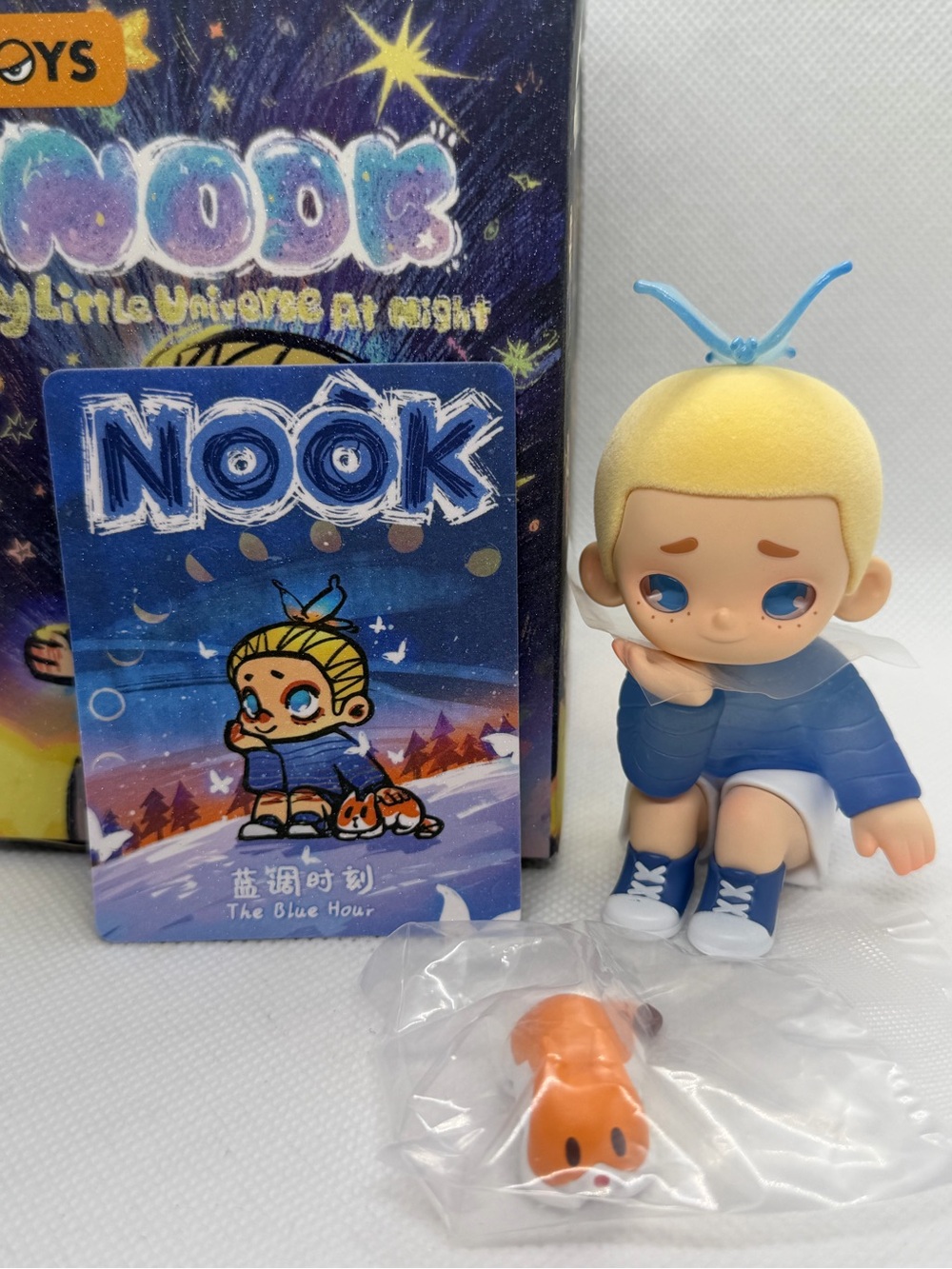 Nook Kids Figure in Blue Outfit with Cream Hair and Orange Accessory